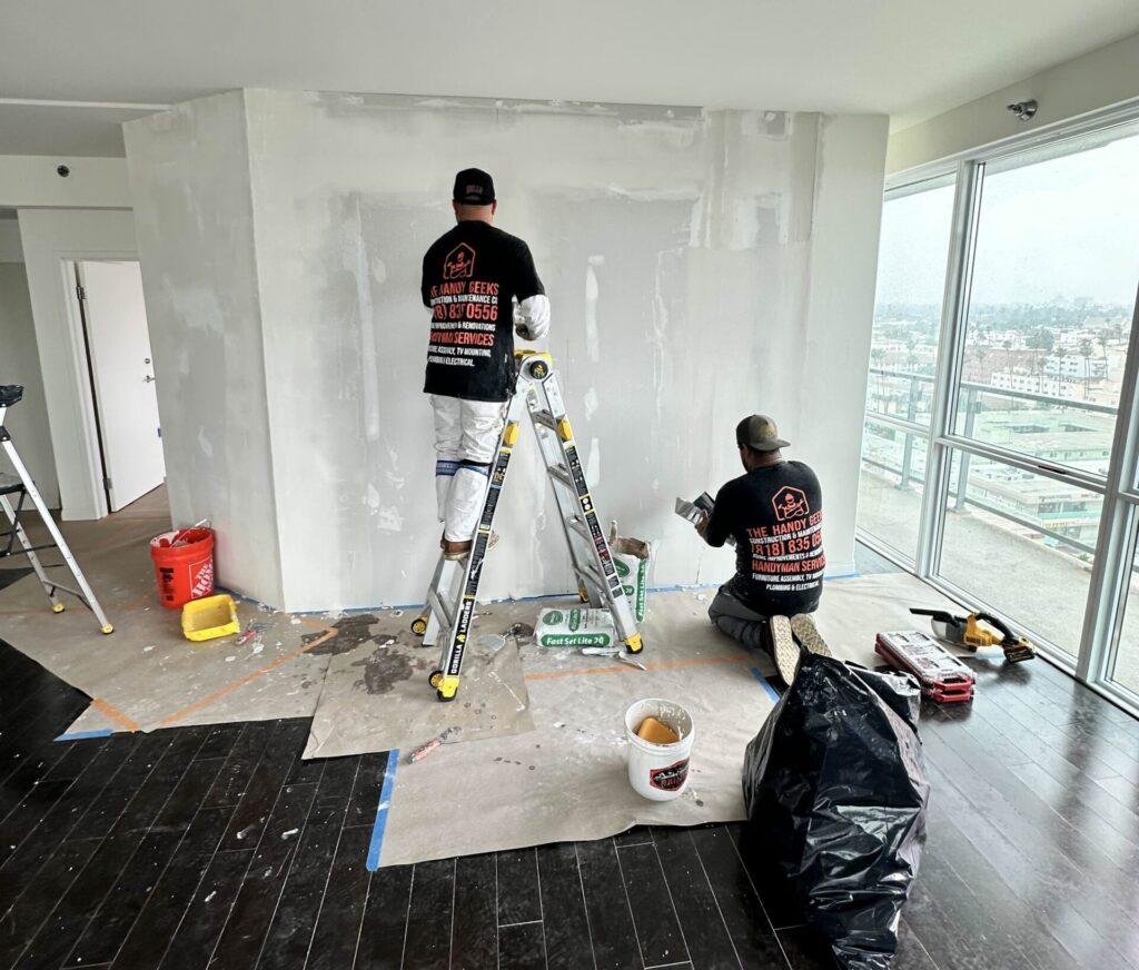 the handy geeks crew working on remodeling an apartment